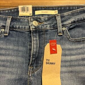 Levi’s 711 Skinny mid rise medium wash jeans